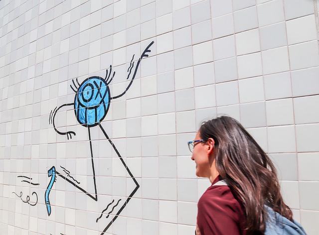 Smiling portrait of Maya, Creative Director, with a comic art filter.